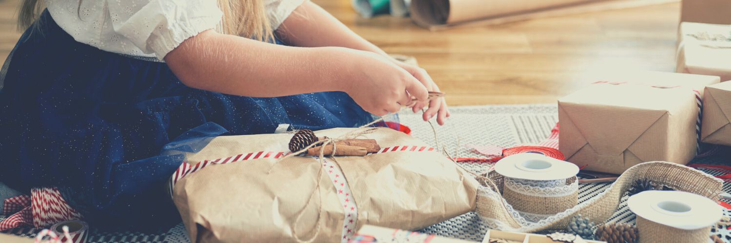 Woman wrapping unique gifts for animal lovers.